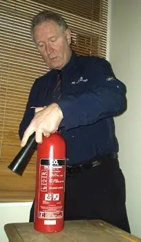 Servicing a fire extinguisher